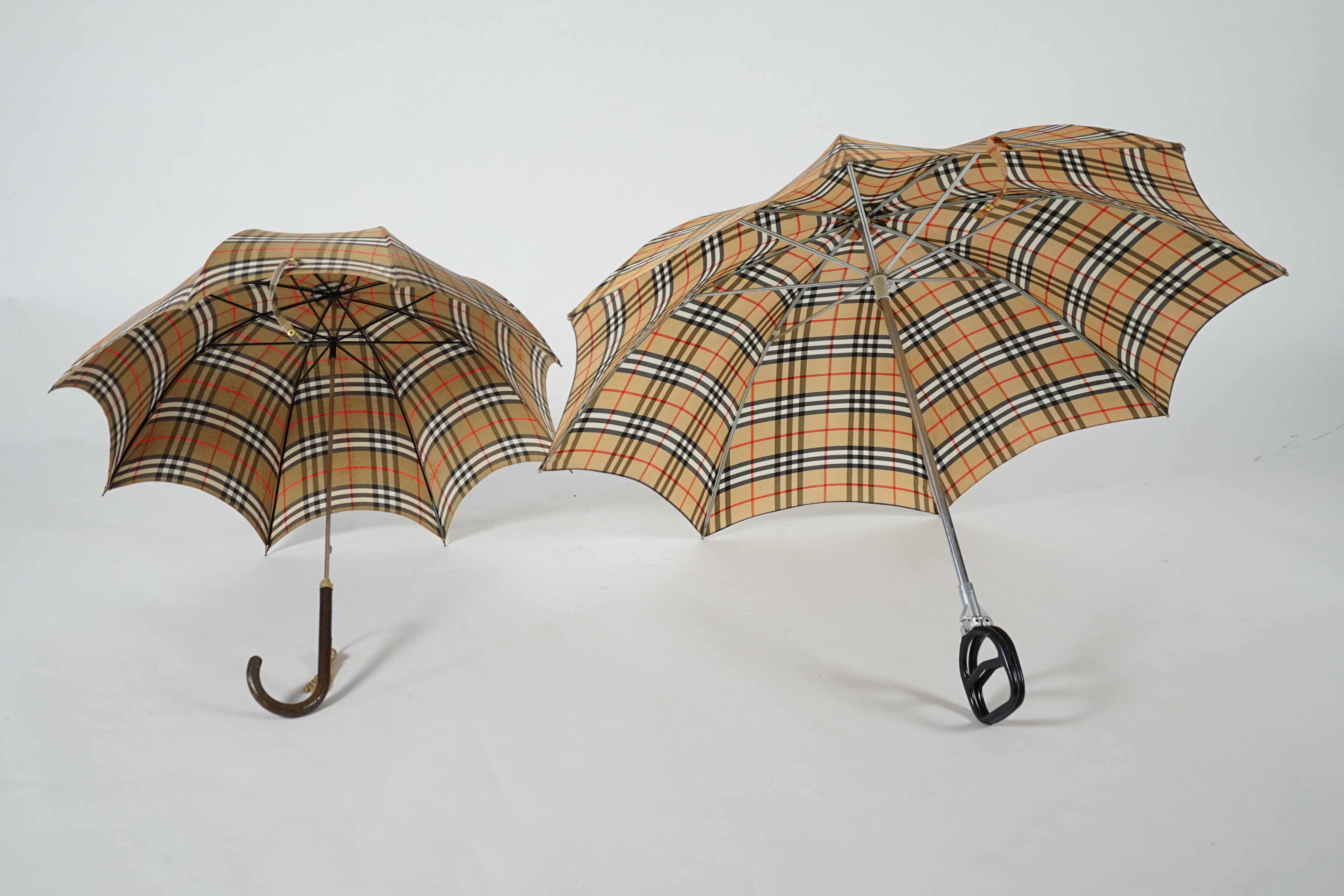 A vintage Burberry shooting stick umbrella and a lady's vintage cotton umbrella, shooting stick height 91cm, umbrella 83cm